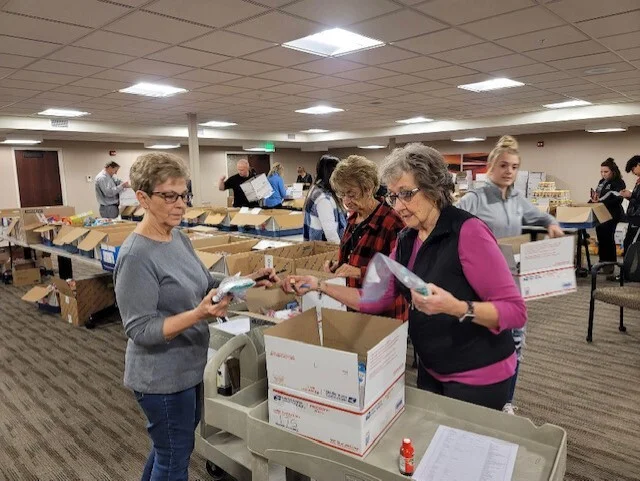 Volunteers packing care packages